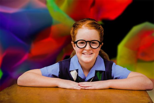 Smiling pupil against colourful abstract design