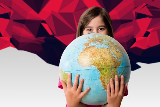 Cute pupil smiling holding globe against red abstract design