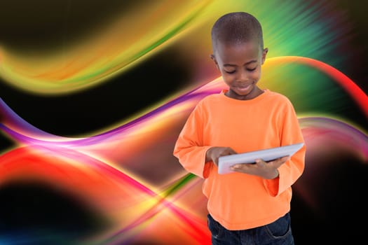 Cute boy using his tablet pc against glowing abstract design