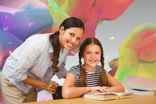 Female teacher and little girl in library against colourful abstract design