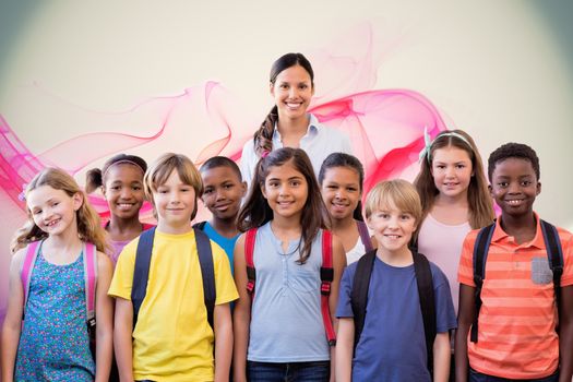 Cute pupils smiling at camera in the hall  against pink abstract design