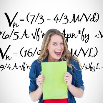 Smiling student holding notebook against maths equation