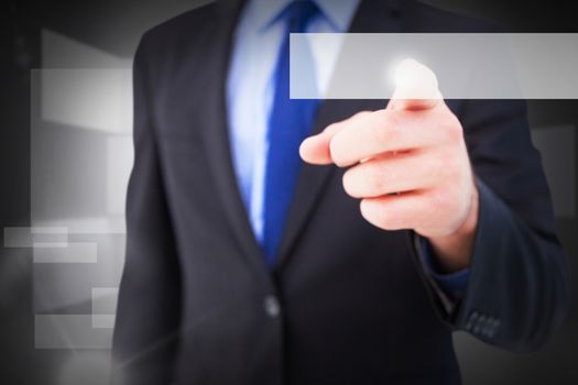 Businessman pointing his finger at camera against abstract room