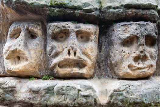 Scary Stone Heads - rock sculptures of giant heads carved into the sandstone cliffs in the pine forest above the village Zelizy in the district Melnik, Czech republic. It is the works of sculptor Vaclav Levy, who created in the period 1841-1846.