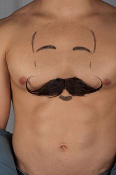 male torso with moustache and beard at chest