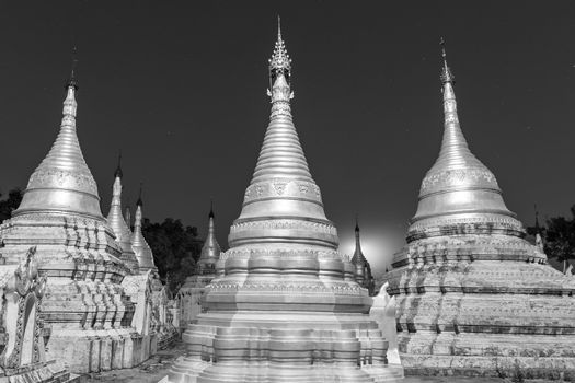 Ancient temple close to Pindaya Cave located next to the town of Pindaya, Shan State, Burma, Myanmar,  Famous buddhist pilgrimage site and a tourist attraction. Black and white image.
