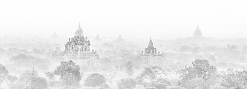 Temples of Bagan an ancient city located in the Mandalay Region of Burma, Myanmar, Asia. High key black and white image.