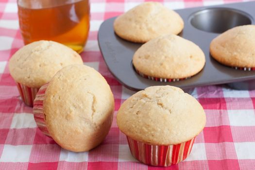 Honey flavored muffins on a kitchen table.