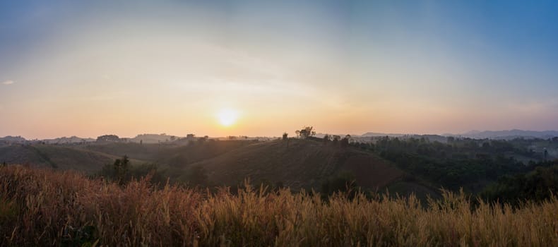 Colorful autumn panorama of the mountains. Sunrise