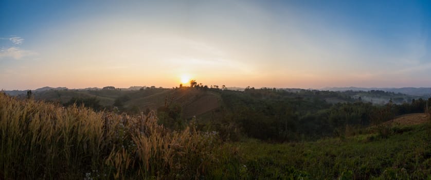 Colorful autumn panorama of the mountains. Sunrise