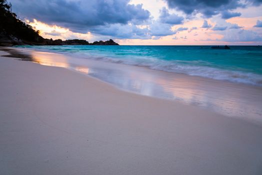 Beautiful beach and sea waves at sunset in summer on Koh Miang island, Mu Koh Similan National Park, Phang Nga Province, Thailand
