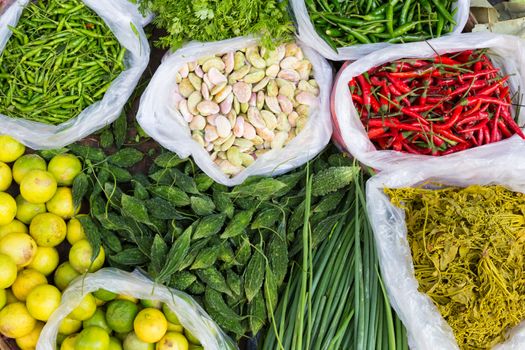 Exotic asian farmers market with various domestic colorful fresh fruits and vegetable.