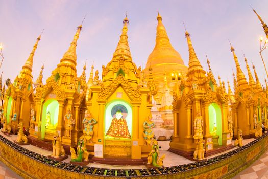 Twilight over Swedagon Paya in Yangon, Myanmar Burma. Fish eye lens shot.