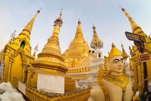 Twilight over Swedagon Paya in Yangon, Myanmar Burma. Fish eye lens shot.