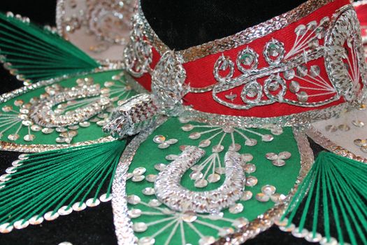 sequin and decorative ornate mexican hat ready for a fiesta with a gun