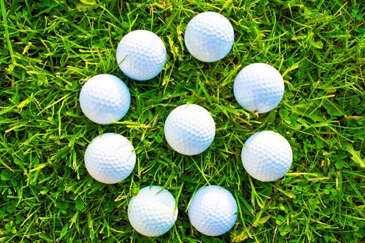 Golf game. Golf balls in grass.