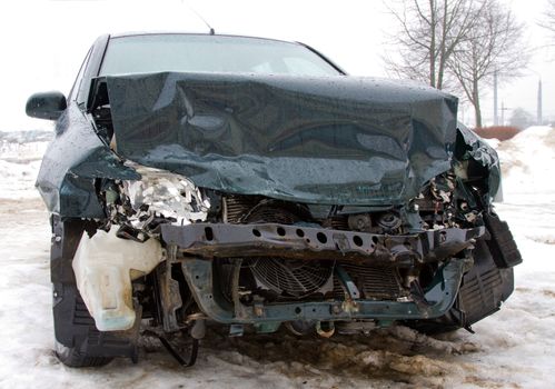 broken car in winter after accident, 