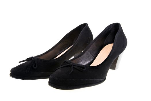 the women's black shoes photographed by a close up, it is isolated