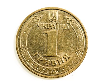 Yellow Ukrainian Hryvnia coin isolated on white