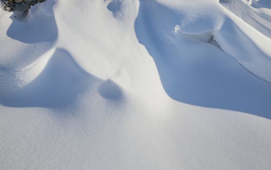  the snowdrift of snow formed after a snow storm