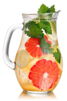 Jug of lemonade with lemon balm and grapefruit