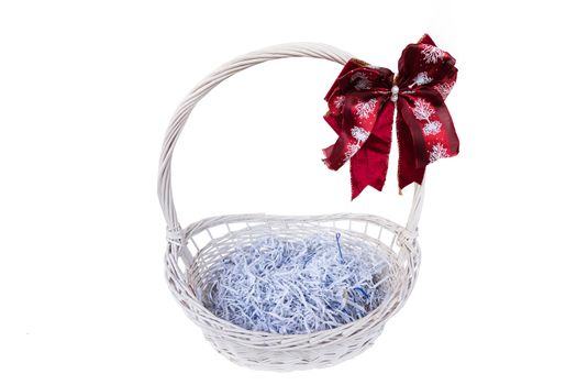 basket with a red bow isolated on white