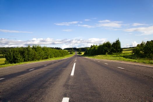 little asphalted road in the summer time