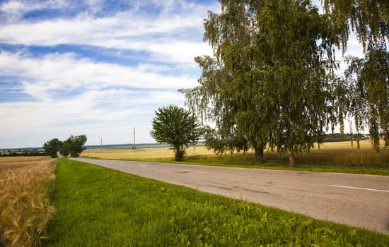  not asphalted the small roads passing on an agricultural field.