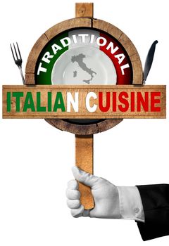 Hand of chef with white glove holding a sign with text Traditional Italian Cuisine, silver cutlery, empty plate and italian flag. Isolated on white background
