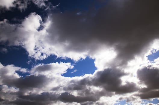   a large number of the clouds being in the dark blue sky