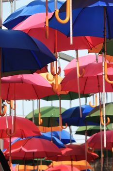 many umbrellas above hanging in air