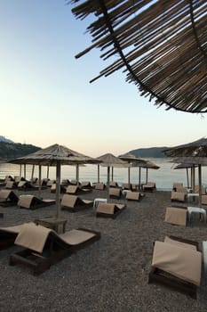   the plank beds being on a beach from a graveyka. Montenegro. sun dawn