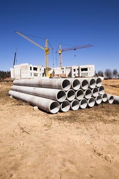   the construction materials lying near the building under construction