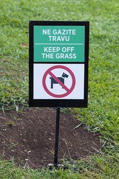  a sign about a circulation ban on the lawns, located in the lawn territory