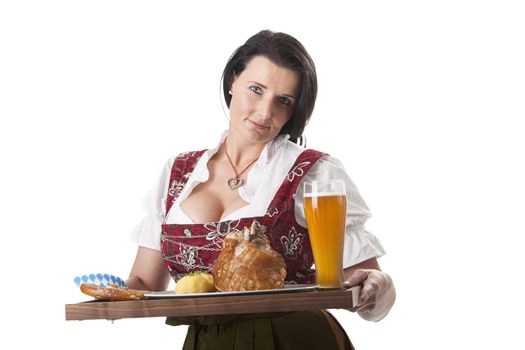 bavarian woman in a dirndl with pork