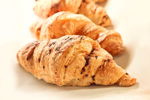 Food conceptual image. chocolate croissant on white background. 