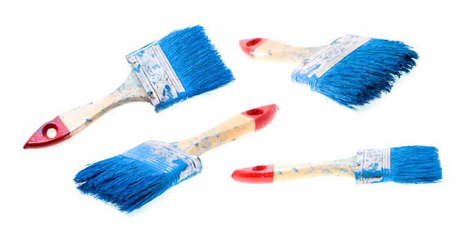 the brush in blue paint, isolated on white