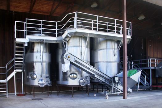 Modern aluminum barrels where grape juice is aged into wine