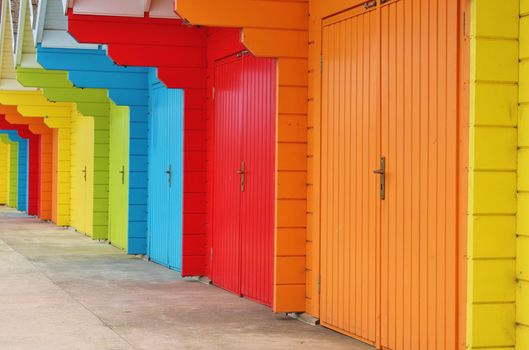 colourful paint wooden Victorian beach hut at the seaside