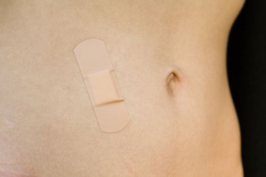 band-aid, pasted on the belly girls