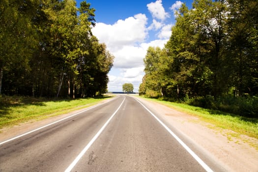 paved road in the summer time