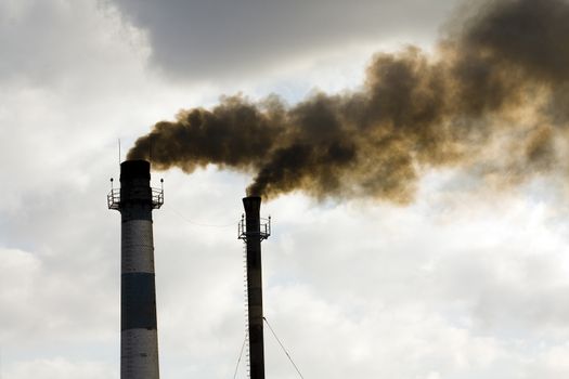 pipes, of which comes out black smoke