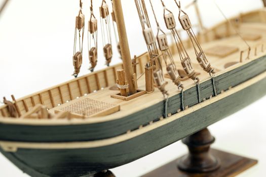   the part of model of the ship made of a tree. photographed by a close up