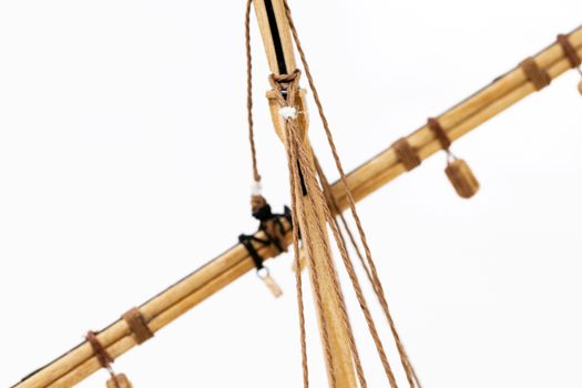  the part of model of the ship made of a tree. photographed by a close up