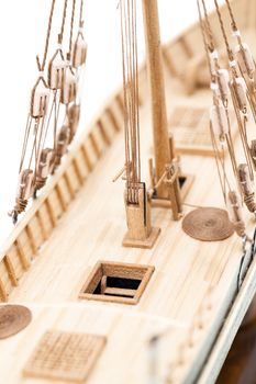  the part of model of the ship made of a tree. photographed by a close up