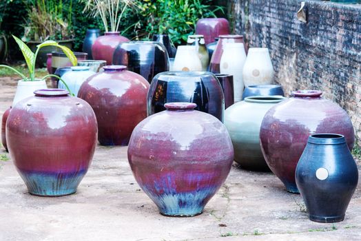 There are many clay pots in the workshop