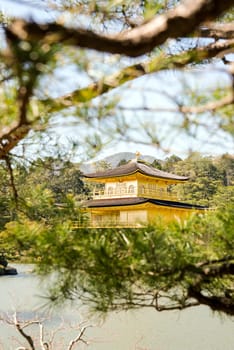 Kinkakuji (Golden Pavilion) is a Zen temple in northern Kyoto whose top two floors are completely covered in gold leaf.