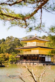 Kinkakuji (Golden Pavilion) is a Zen temple in northern Kyoto whose top two floors are completely covered in gold leaf.