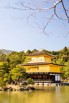 Kinkakuji (Golden Pavilion) is a Zen temple in northern Kyoto whose top two floors are completely covered in gold leaf.