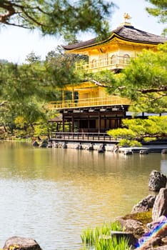 Kinkakuji (Golden Pavilion) is a Zen temple in northern Kyoto whose top two floors are completely covered in gold leaf.